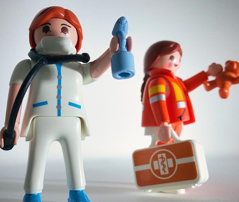A photo of two toy medical providers