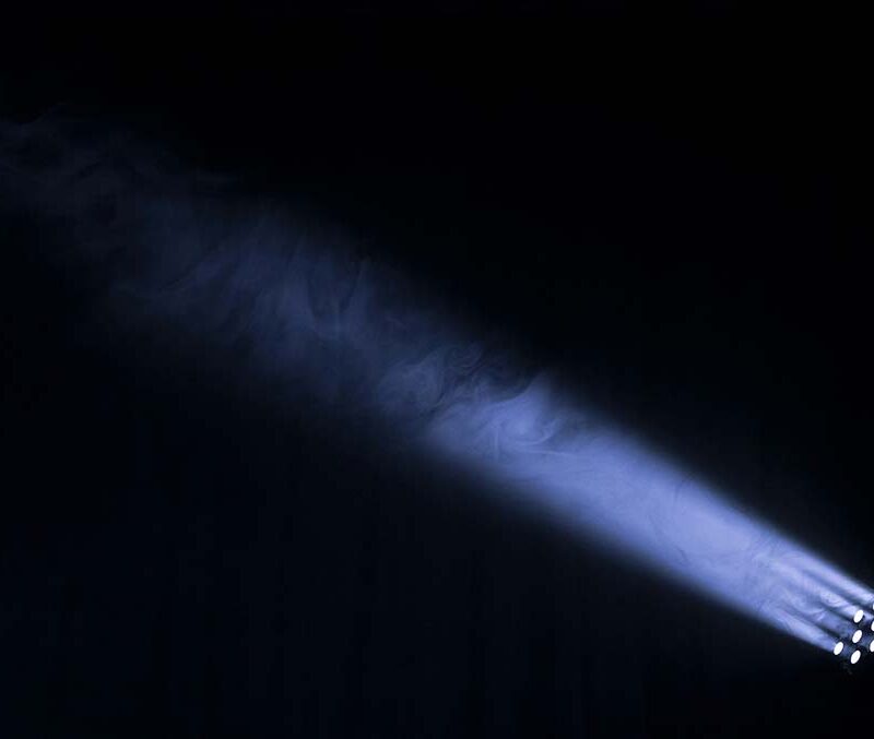 Narrow purple light beams on a black background