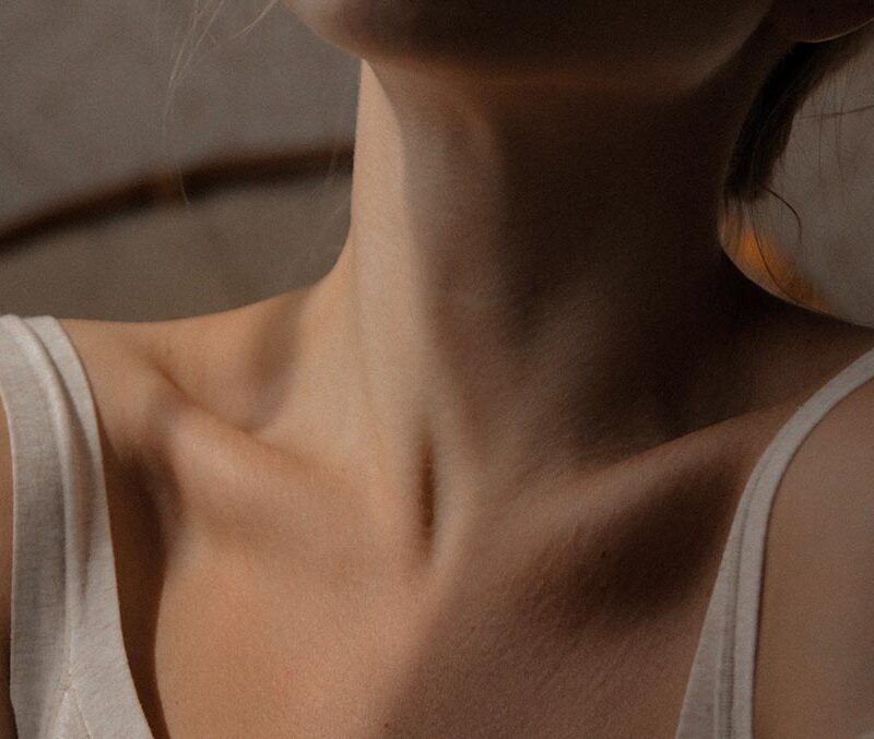 A photo of a woman's neck.