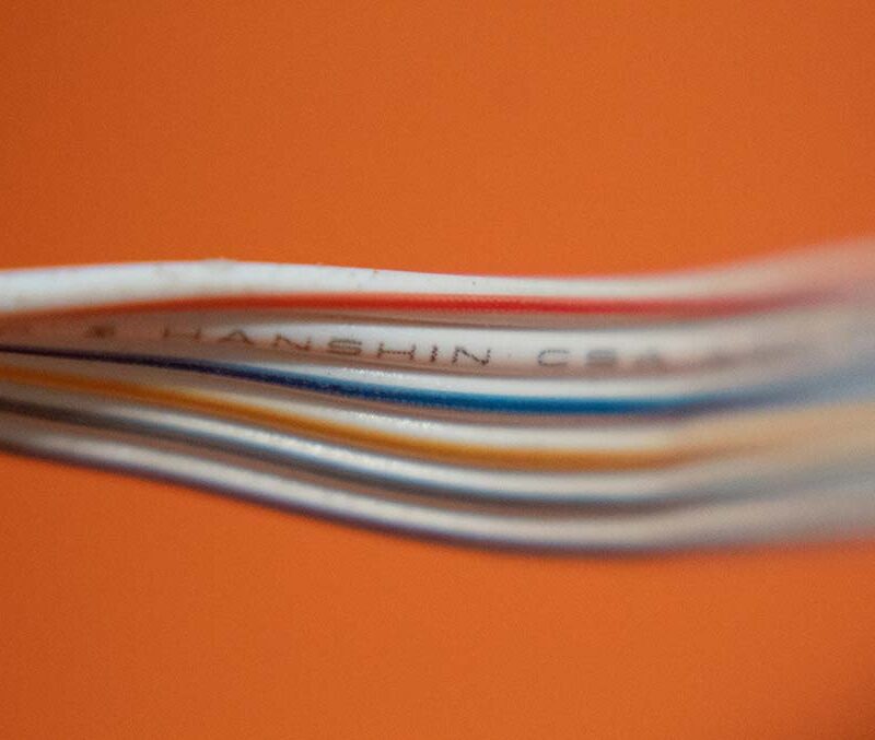 wires set in front of an orange background