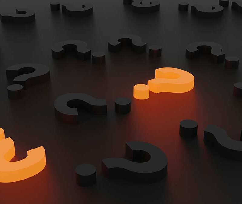 Question marks with two that are lit up in orange with others in black.